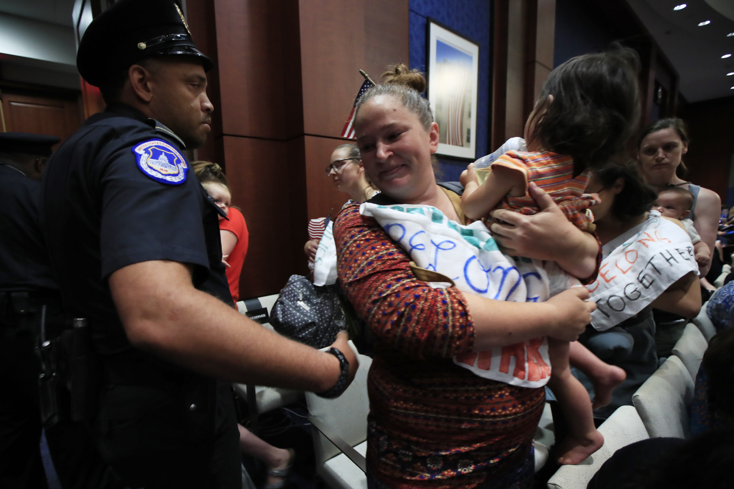 Photo of Lucy Martin and her daughter Branwen Espinal, who are removed from the hearing floor of the House.