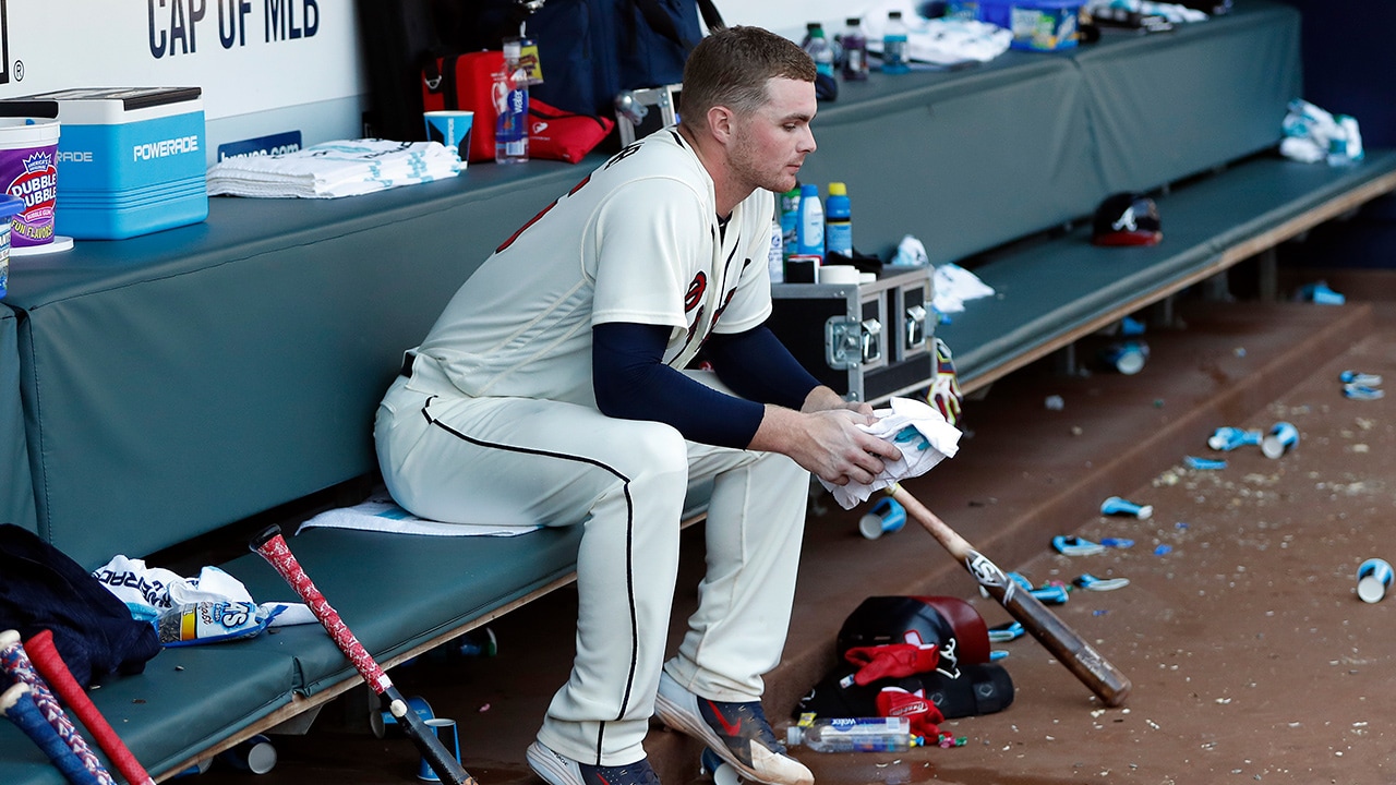 Photo of Sean Newcomb in dugout at Braves + Dodgers game