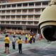 Photo of a security camera overlooking a school play yard