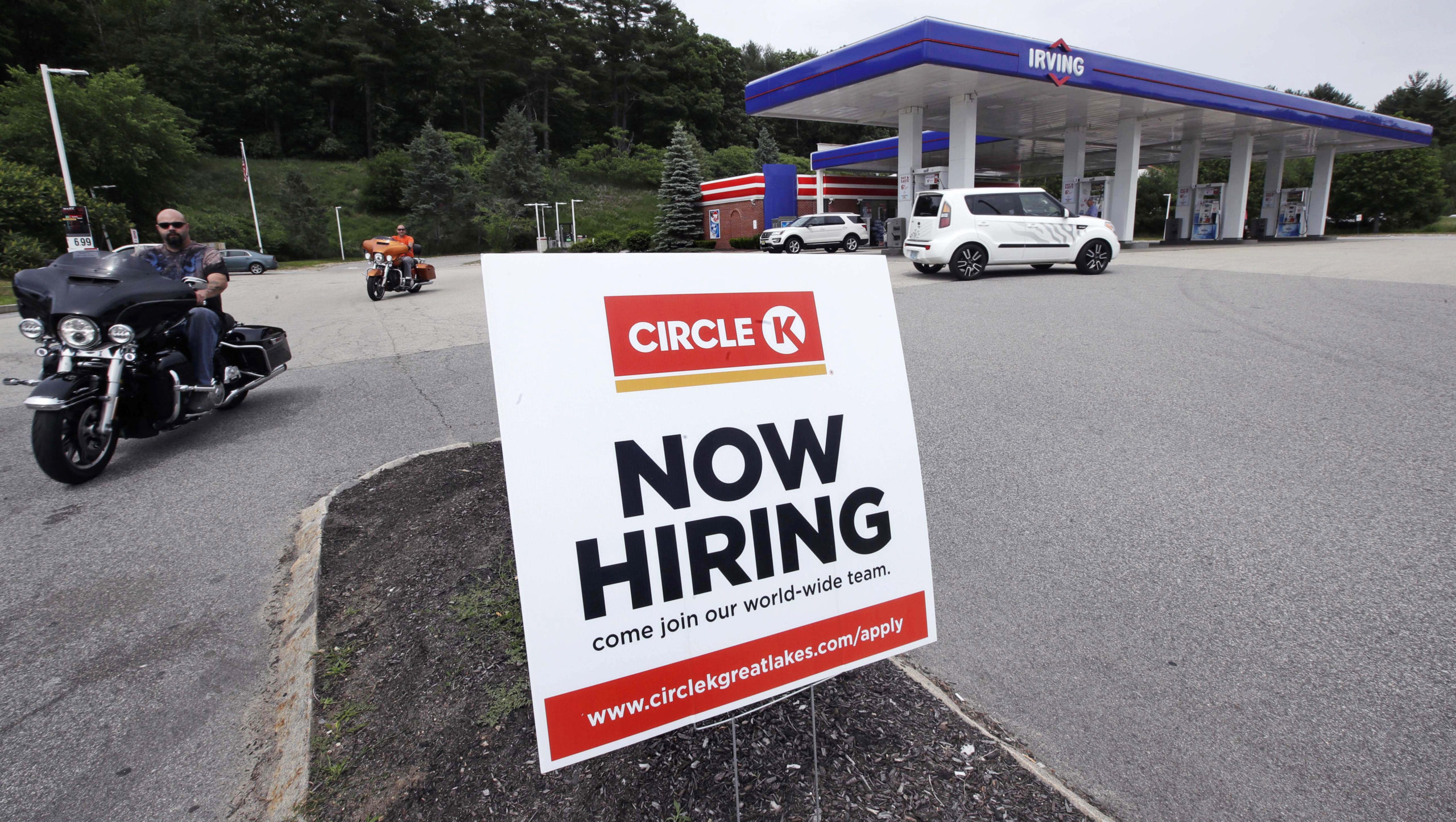 Photo of a "Now Hiring" sign