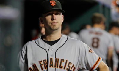 Photo of San Francisco Giants' Buster Posey walking in the dugout