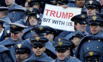 Photo of an Army cadet holding a sign for President Donald Trump