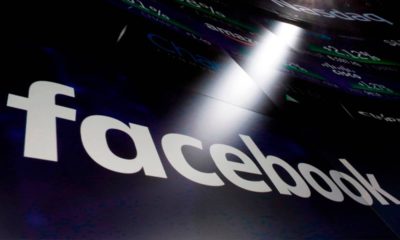 Photo of Facebook logo appearing on a screen at the Nasdaq MarketSite in New York