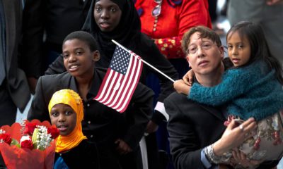 Photo of family members welcoming their relatives as new US citizens