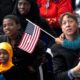 Photo of family members welcoming their relatives as new US citizens