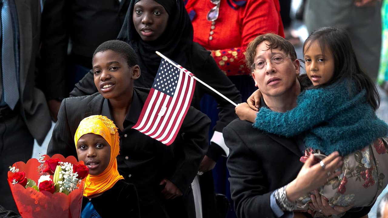 Photo of family members welcoming their relatives as new US citizens