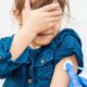 Photo of a young girl getting vaccinated
