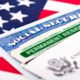 Composite of green card, social security card and American flag