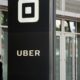 Photo of a man walking into Uber HQ in San Francisco