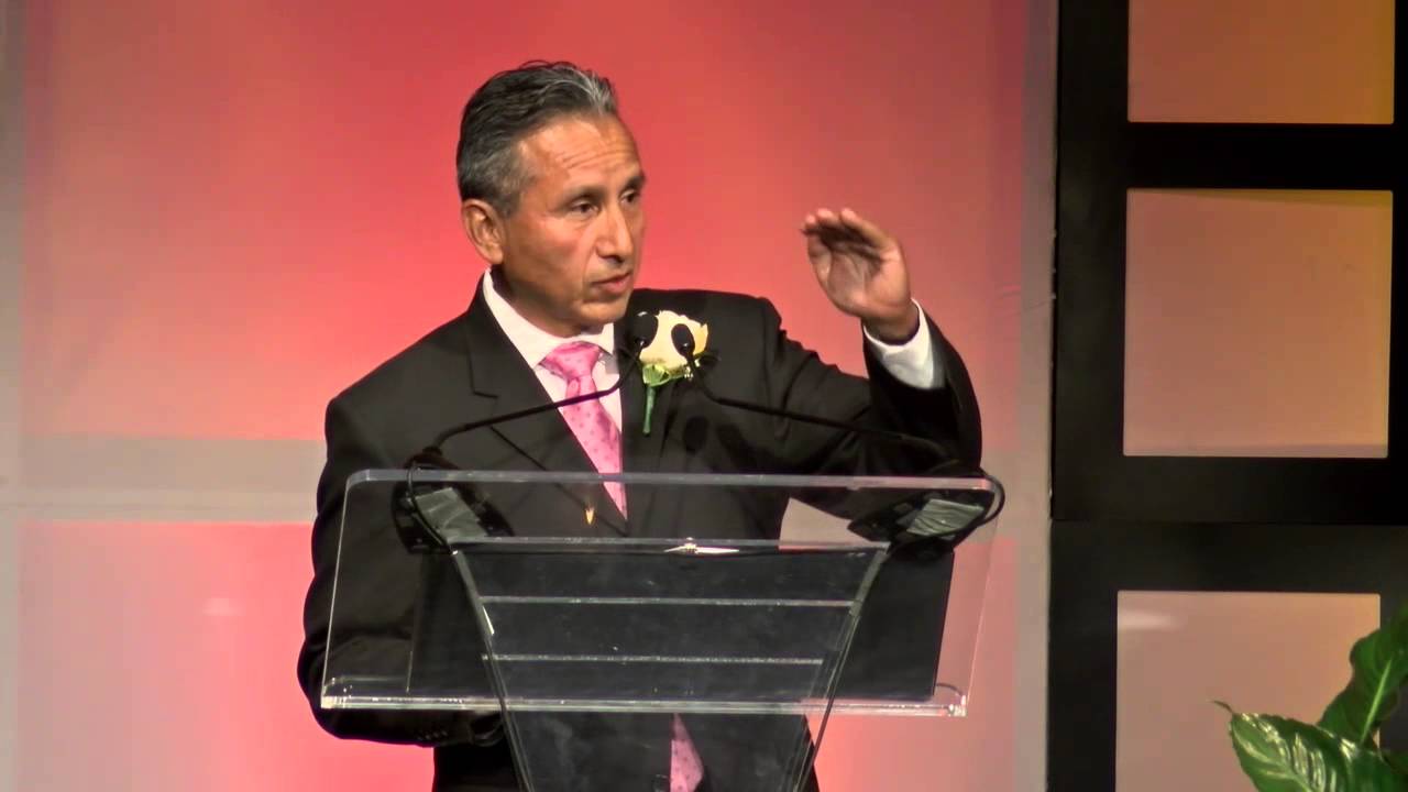 Photo of Henry R. Perea speaking at a podium