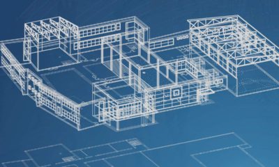 Image of blueprints for a school on a blue background
