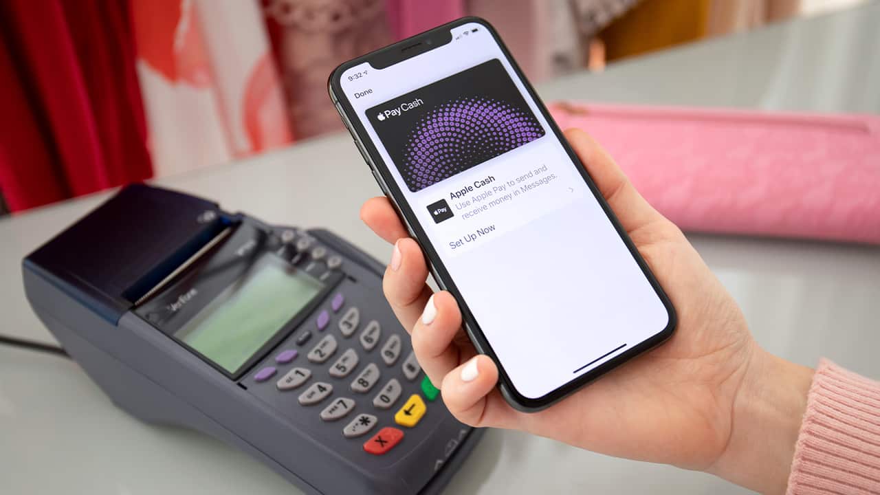Photo of a woman paying with Apple Pay