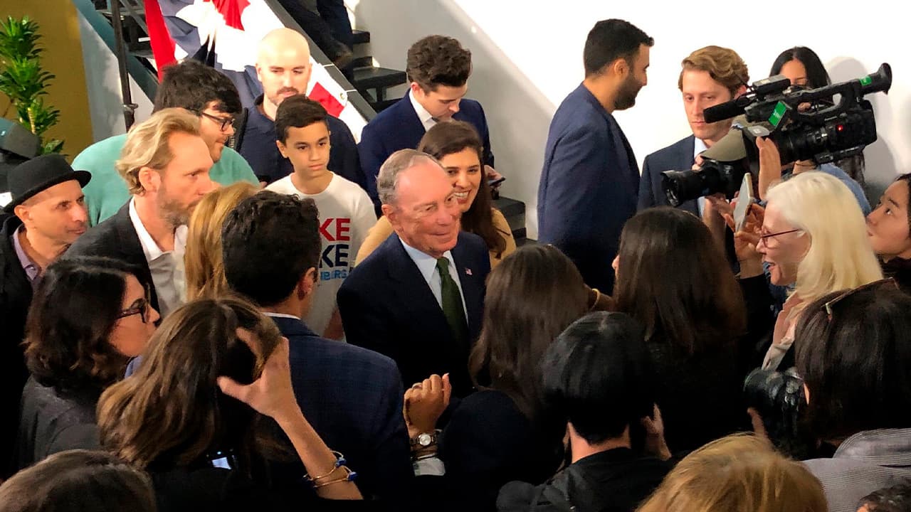 Photo of Michael Blolomberg greeting supporters and media