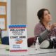 Photo of a poll worker speaking to a voter
