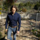 Photo of Jason Meeks walking through the remains of his hime in Santa Rosa, Calif.