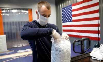 Photo of A.J. Davidson packing face masks
