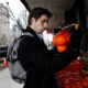 Photo of Liam Elkind looking at oranges
