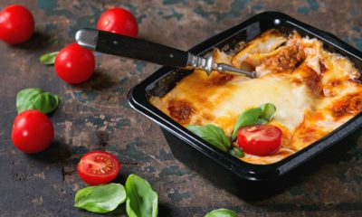 Photo of baked lasagna in a to-go container