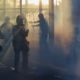 Photo of police moving through demonstrations