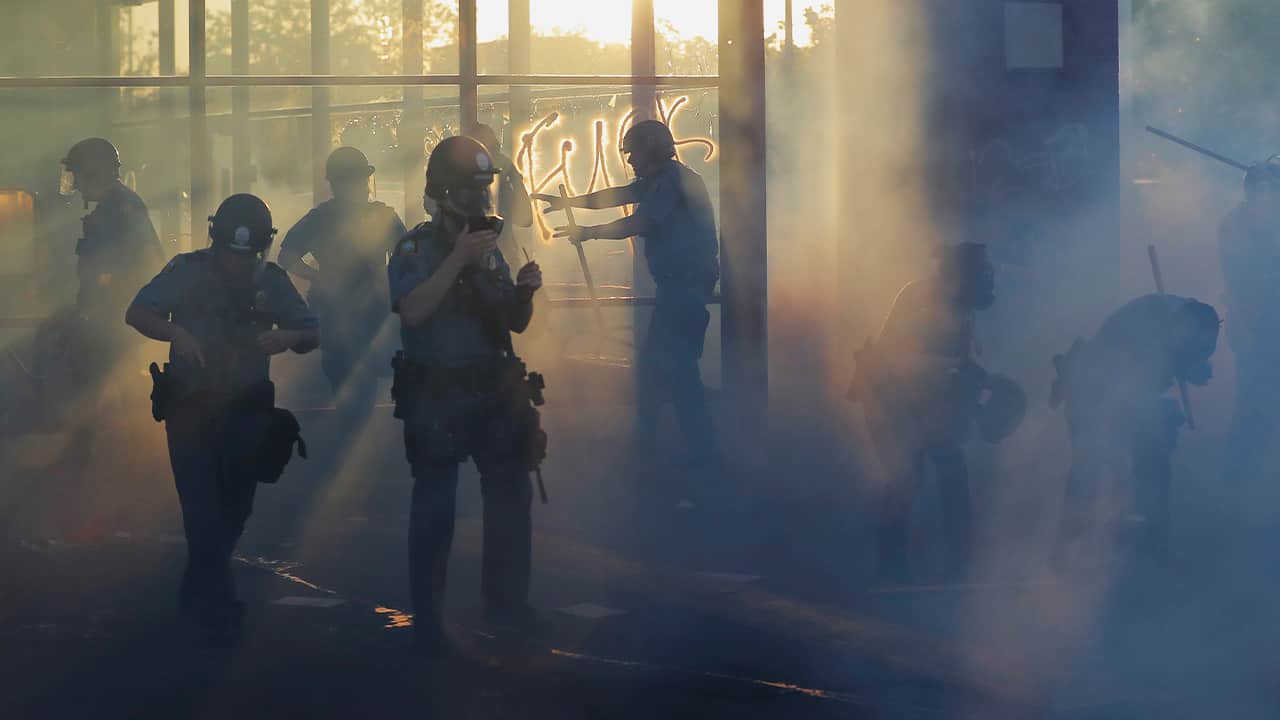 Photo of police moving through demonstrations