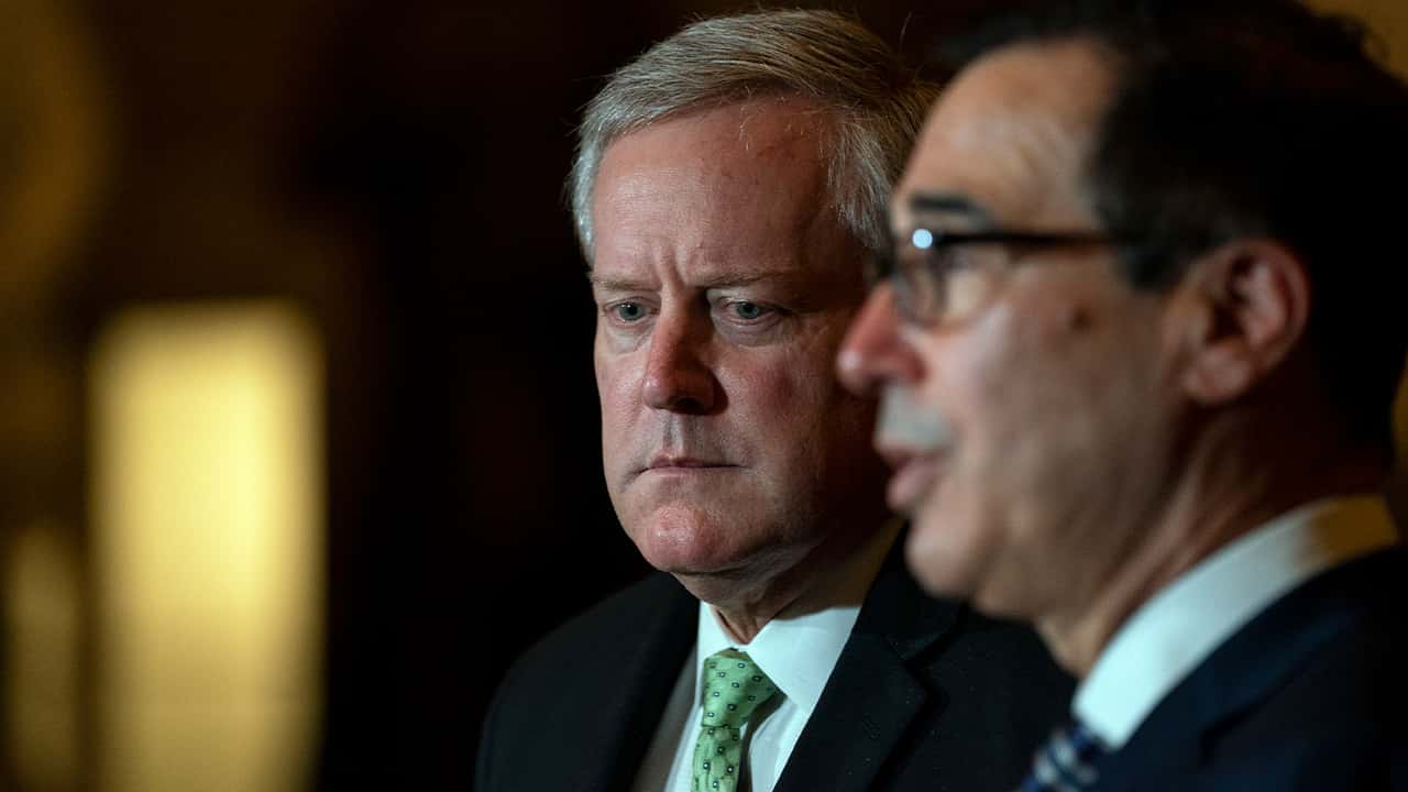 Treasury Secretary Steven Mnuchin speaks to reporters as White House chief of staff Mark Meadows