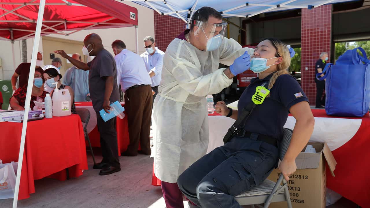 Photo of a woman getting a COVID test